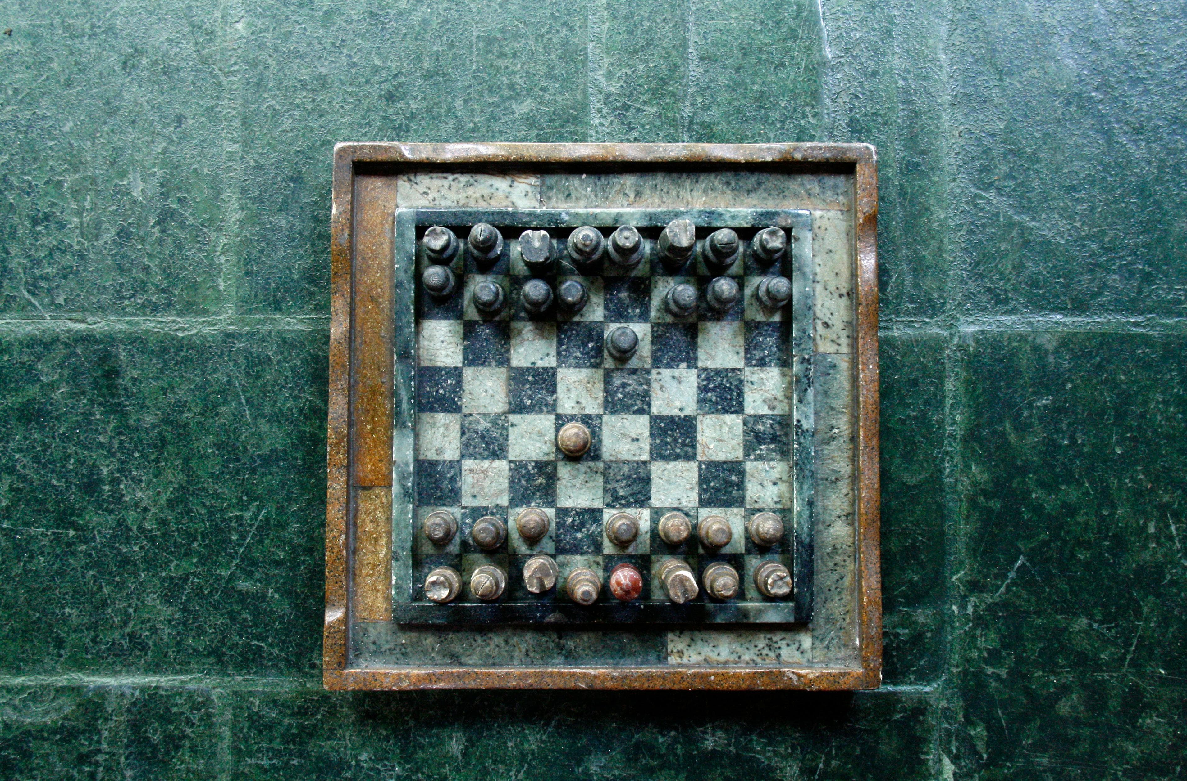 Chessboard with a queen side pawn advancing 2 squares on the white side.