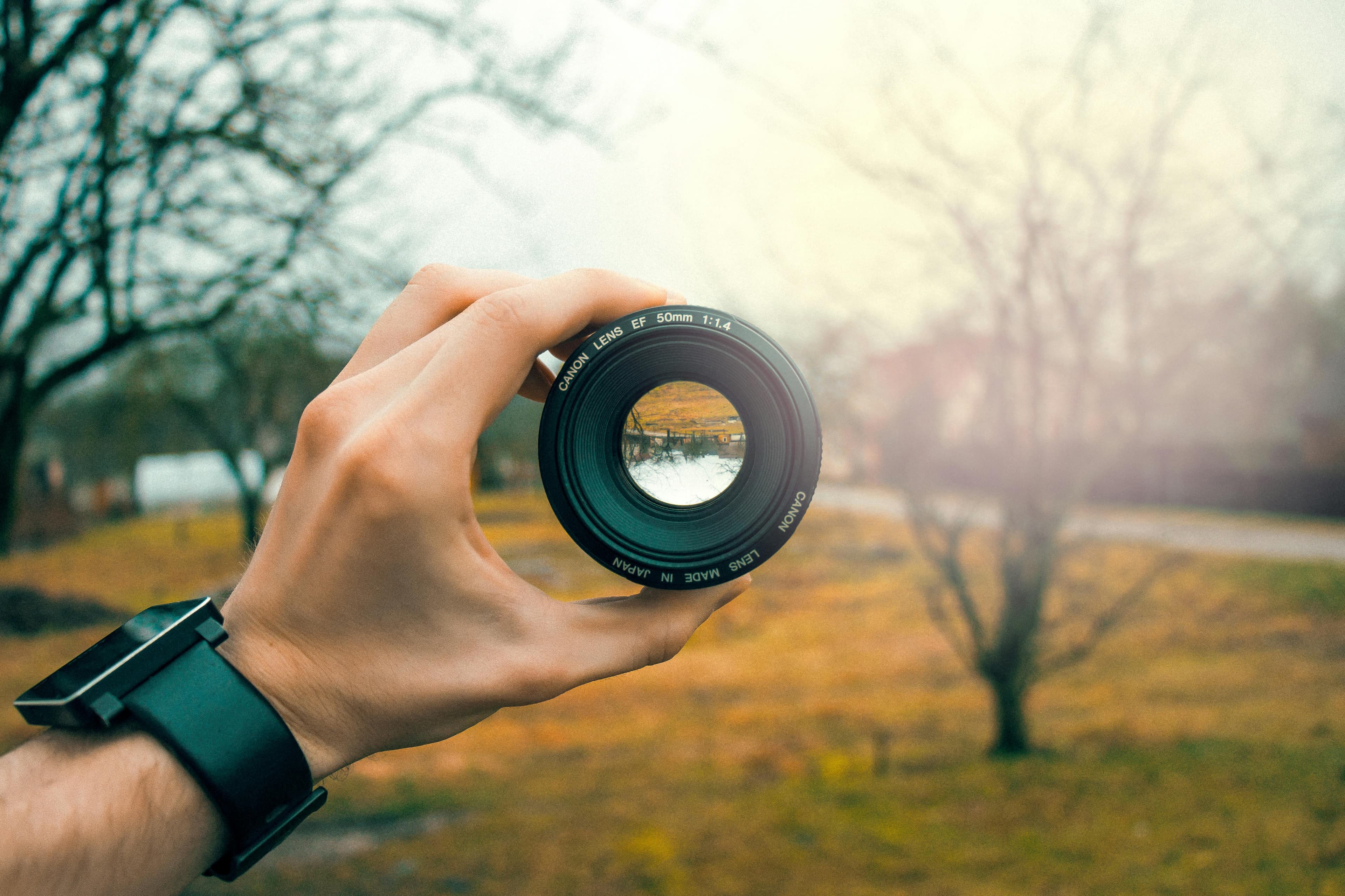 A lens being held up to the sky.